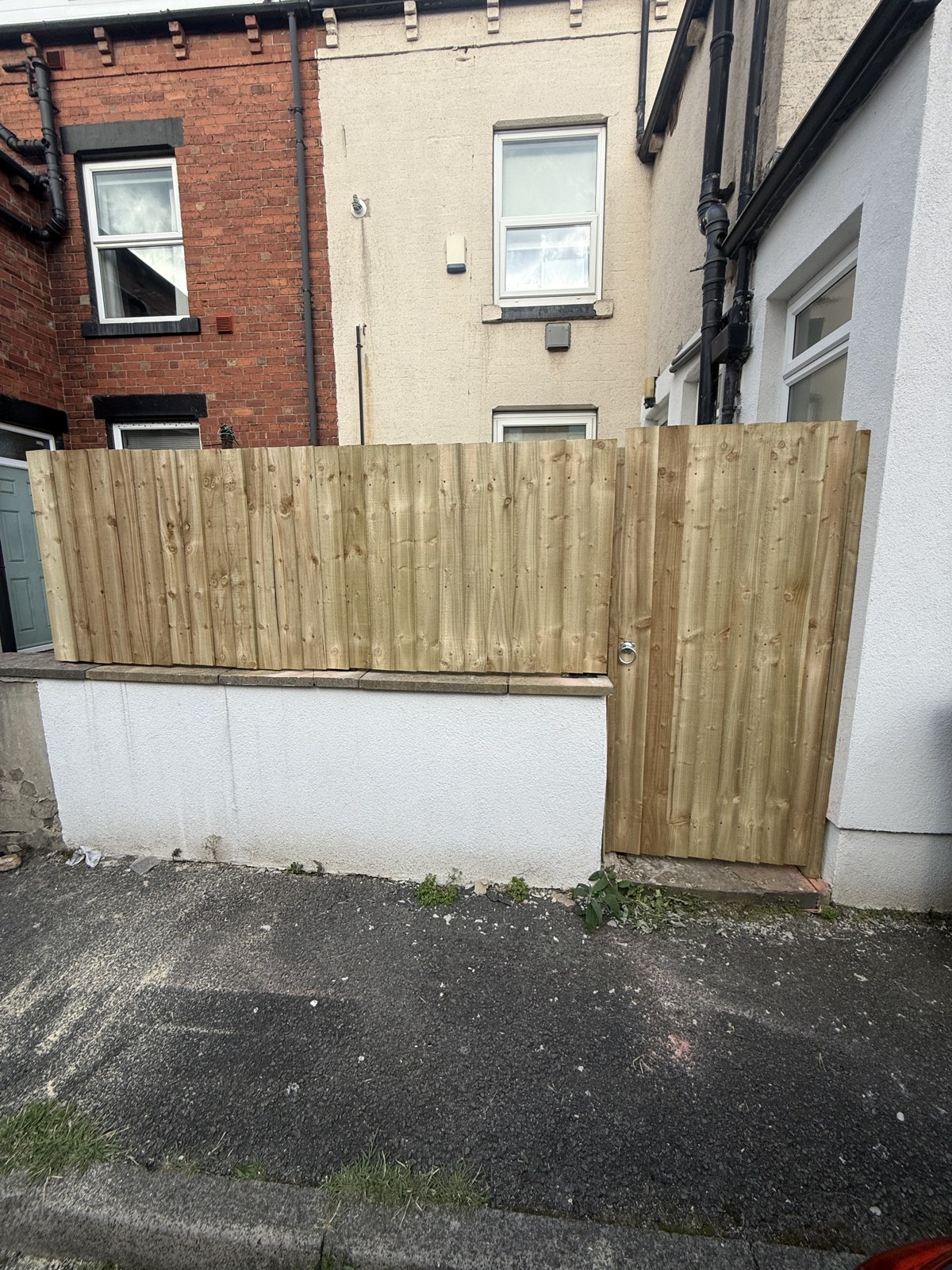 Closeboard fence & gate on garden wall — after