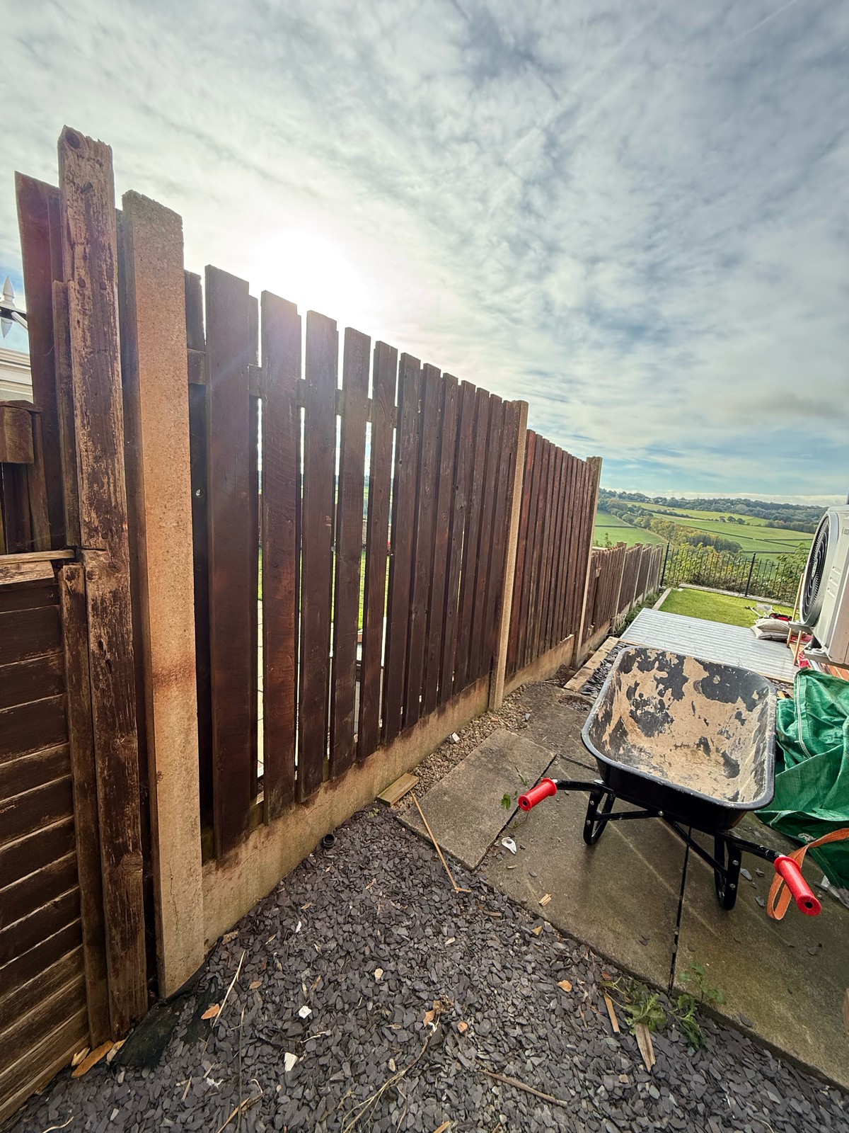 New curved-top palisade fence — before